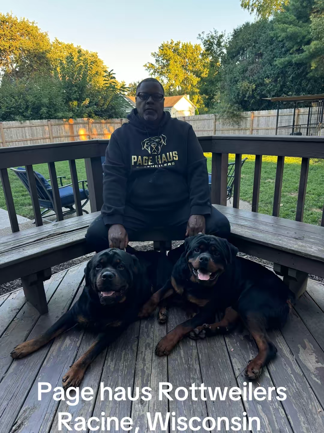 Rottweiler resting at the feet of Willie Page